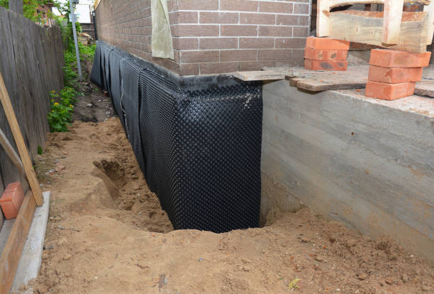 Happy homeowners after waterproofing job in Middlesex